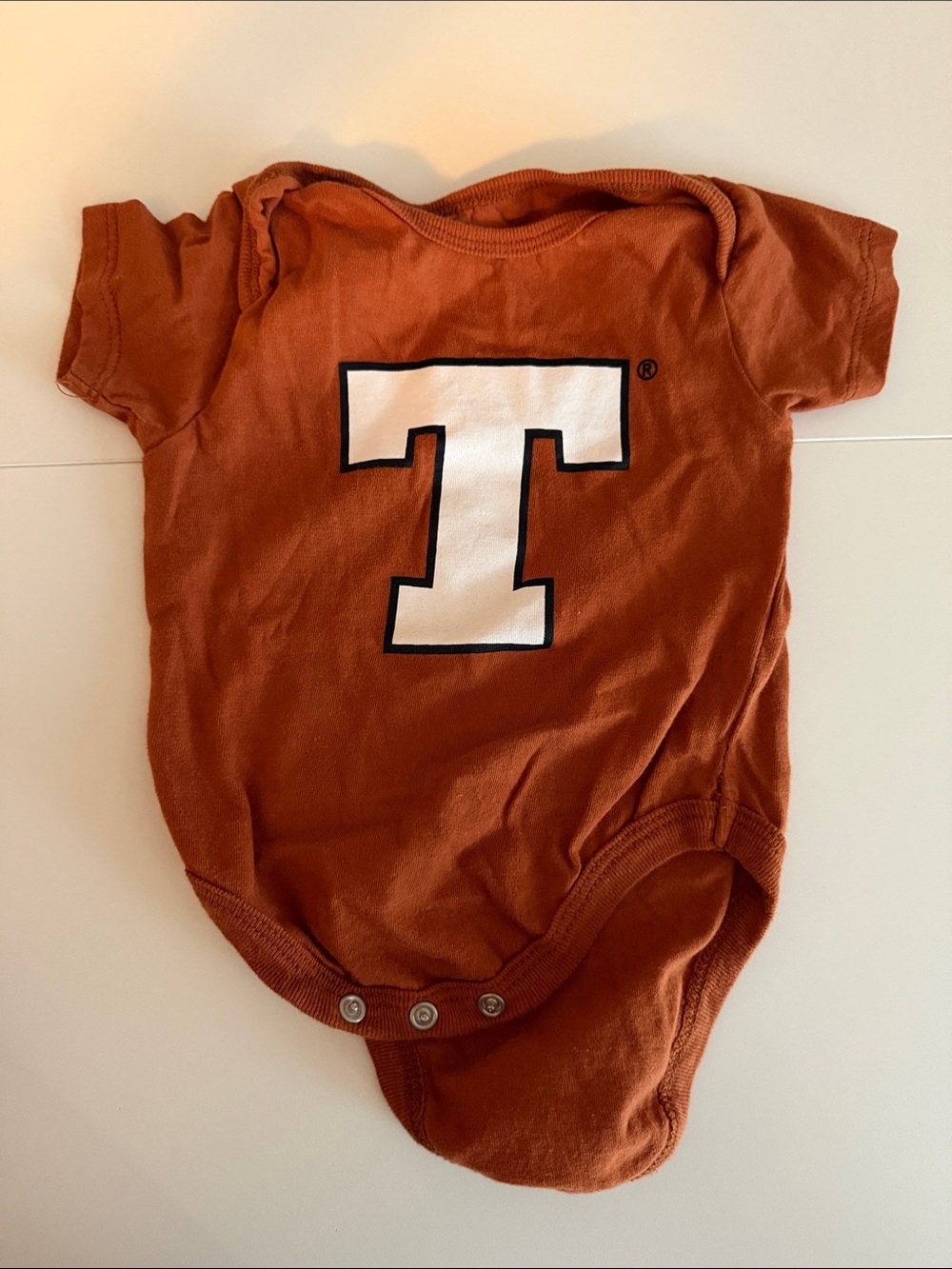 Kids One-Piece Bodysuit in Rust with White T Graphic